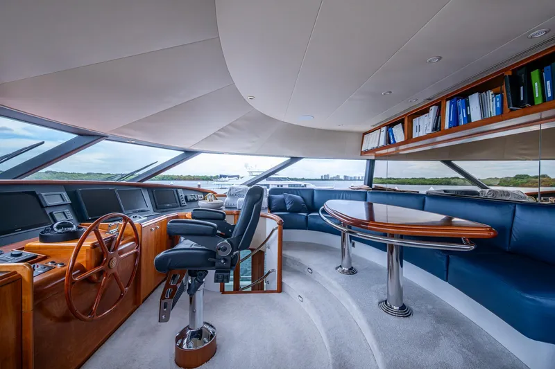 Lila Cuy Yacht Photos Pics Luxurious 2006 Westport 112 yacht interior with helm, seating, and panoramic windows.