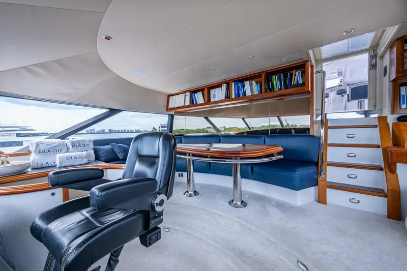 Lila Cuy Yacht Photos Pics Luxurious interior of 2006 Westport 112 yacht with leather seating and wooden accents.