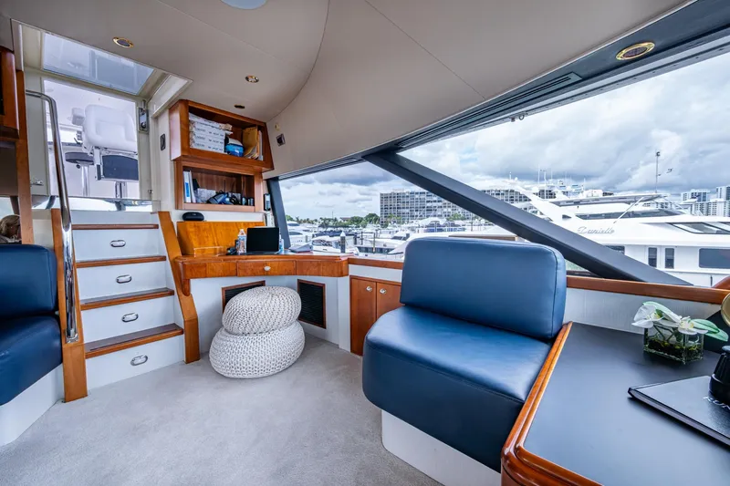 Lila Cuy Yacht Photos Pics Luxurious interior of 2006 Westport 112 yacht with modern seating and marina view.