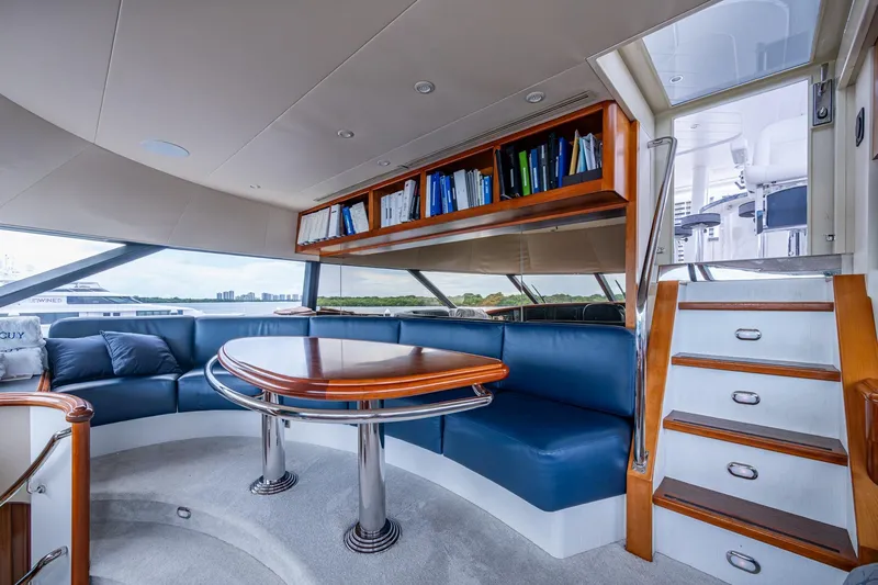 Lila Cuy Yacht Photos Pics Luxurious interior of 2006 Westport 112 yacht with elegant seating and wooden accents.