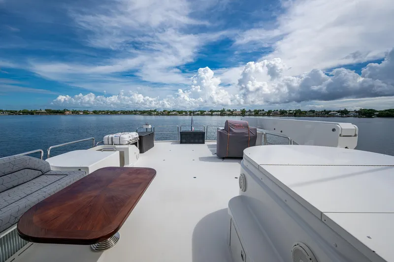 Lila Cuy Yacht Photos Pics Luxurious 2006 Westport 112 yacht deck with scenic waterfront view.