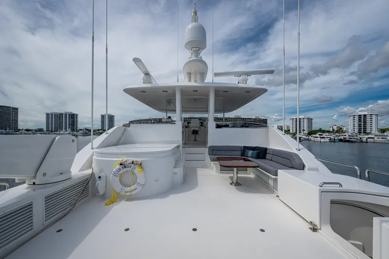 Lila Cuy Yacht Photos Pics Luxurious 2006 Westport 112 yacht deck with seating area and cityscape view.