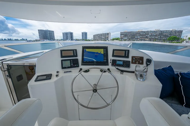 Lila Cuy Yacht Photos Pics Helm of 2006 Westport 112 yacht with navigation equipment and waterfront view.