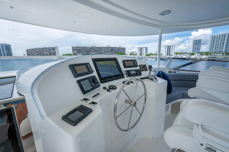 Lila Cuy Yacht Photos Pics Helm of 2006 Westport 112 yacht with modern navigation equipment and luxurious seating.