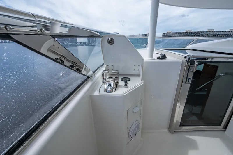 Lila Cuy Yacht Photos Pics Control panel on 2006 Westport 112 yacht, overlooking water and cityscape.