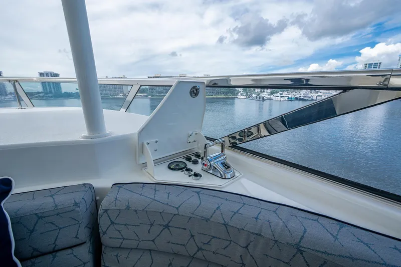 Lila Cuy Yacht Photos Pics Luxury yacht Westport 112 helm view, 2006 model, overlooking marina and skyline.