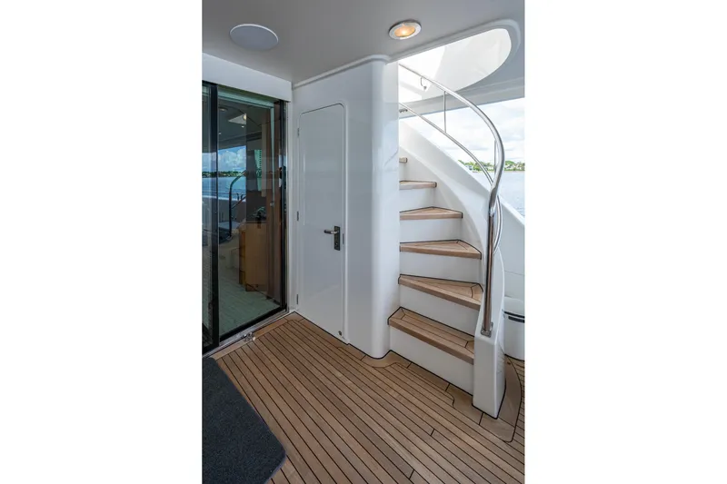 Lila Cuy Yacht Photos Pics Staircase on 2006 Westport 112 yacht with teak flooring and sleek design.