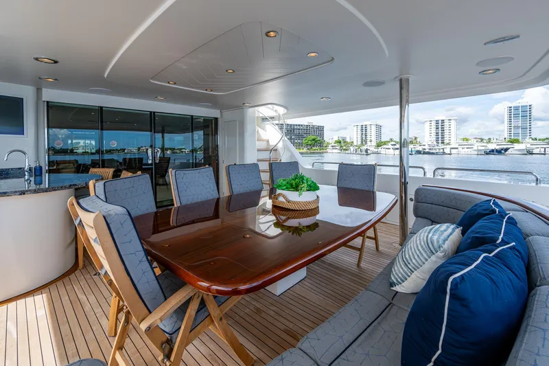 Lila Cuy Yacht Photos Pics Luxurious 2006 Westport 112 yacht deck with elegant dining area and waterfront view.