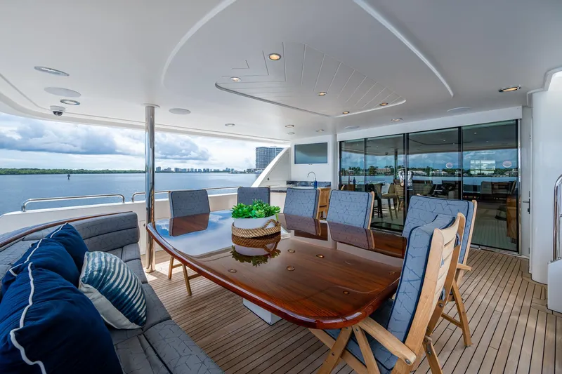 Lila Cuy Yacht Photos Pics Luxurious 2006 Westport 112 yacht deck with elegant dining area and scenic ocean view.