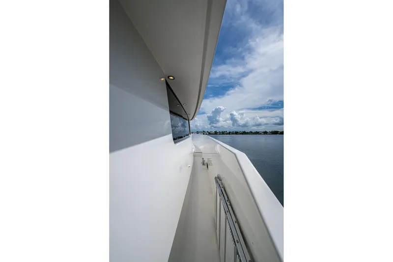 Lila Cuy Yacht Photos Pics Side view of 2006 Westport 112 yacht with ocean and sky backdrop.