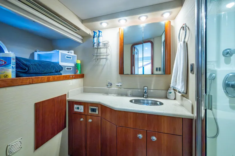 Lila Cuy Yacht Photos Pics Luxurious bathroom in 2006 Westport 112 yacht with modern fixtures and ample storage.