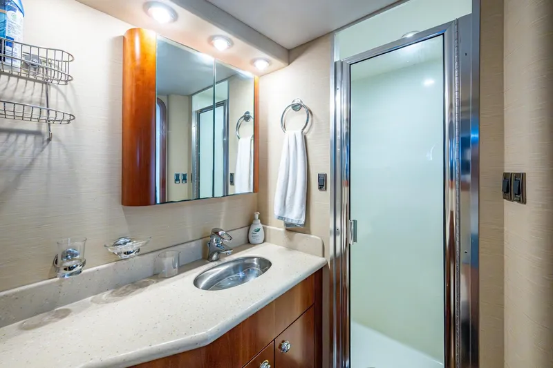 Lila Cuy Yacht Photos Pics Luxurious bathroom in 2006 Westport 112 yacht with modern fixtures and elegant design.