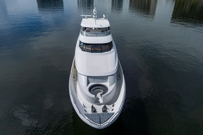 Lila Cuy Yacht Photos Pics Luxury Westport 112 yacht from 2006, aerial view on calm water.