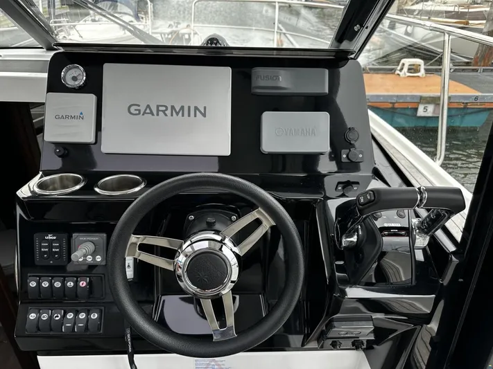  Yacht Photos Pics Helm of 2019 Jeanneau Merry Fisher 1095 FLY with Garmin navigation system.
