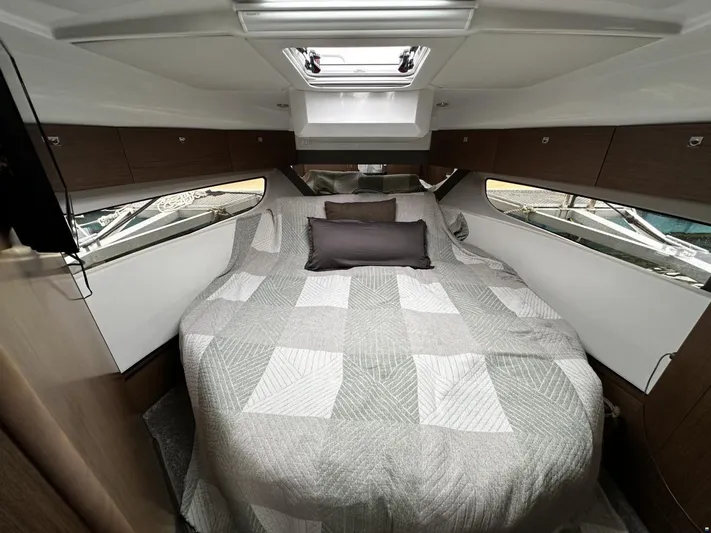  Yacht Photos Pics Cabin interior of 2019 Jeanneau Merry Fisher 1095 FLY with cozy bed and modern design.