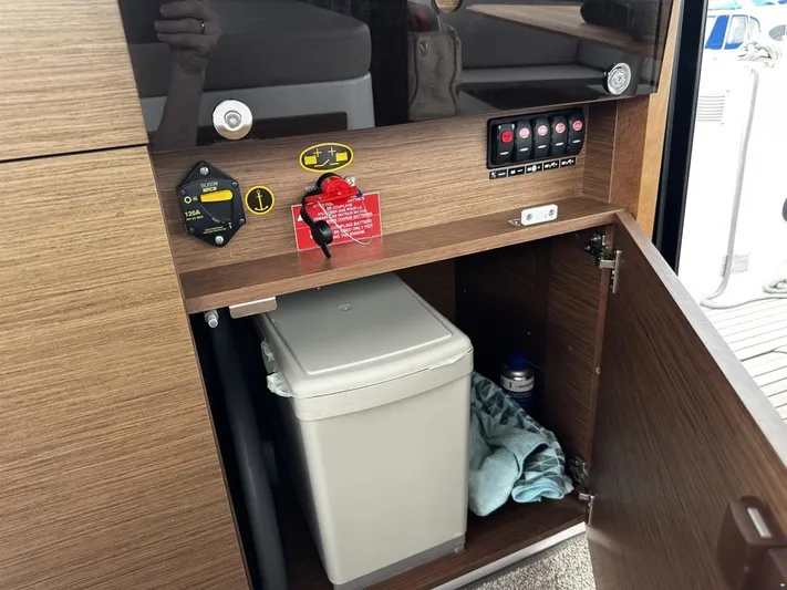  Yacht Photos Pics 2019 Jeanneau Merry Fisher 1095 FLY interior cabinet with control panel and storage.
