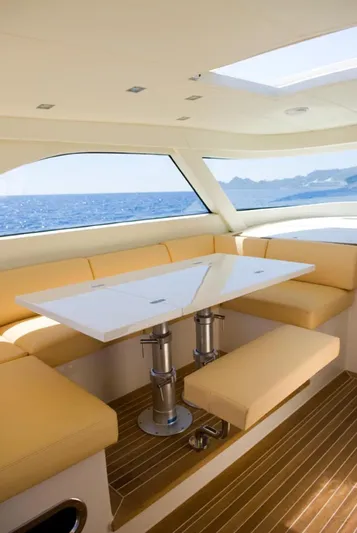 51 Yacht Photos Pics Luxurious Toy 51 yacht interior with elegant seating and ocean view, 2025 model.