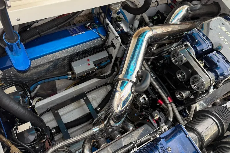  Yacht Photos Pics Engine compartment of a 2010 Fountain 42 Lightning boat, showcasing intricate mechanical components.