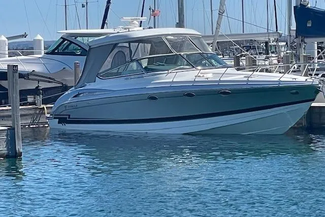  Yacht Photos Pics 2014 Formula 370 Super Sport boat docked in a marina, surrounded by clear blue water.