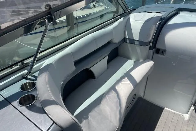  Yacht Photos Pics 2014 Formula 370 Super Sport boat interior with cushioned seating and cup holders.