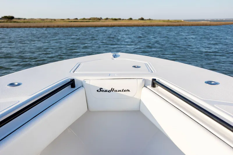  Yacht Photos Pics Bow view of 2014 SeaHunter 32 Tournament boat on calm water.