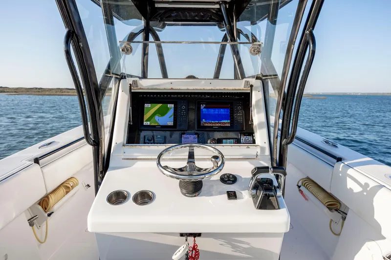  Yacht Photos Pics 2014 SeaHunter 32 Tournament boat dashboard with navigation screens on open water.