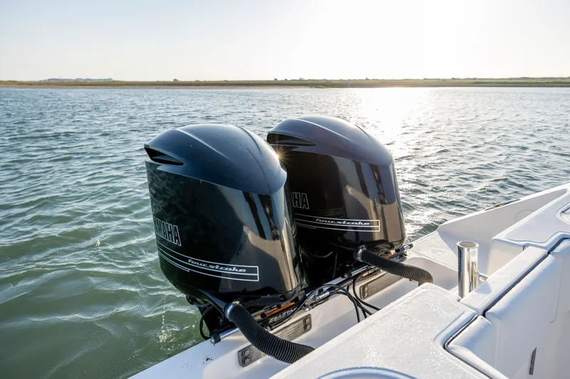  Yacht Photos Pics Twin Yamaha outboard engines on a 2014 SeaHunter 32 Tournament boat in open water.
