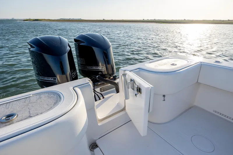  Yacht Photos Pics 2014 SeaHunter 32 Tournament boat with twin Yamaha outboard engines on calm water.