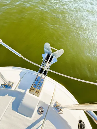  Yacht Photos Pics 2021 Jeanneau NC 895 boat anchor over green water.
