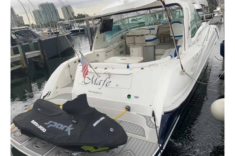Mafe Yacht Photos Pics 2004 Sea Ray 500 Sundancer docked with Sea-Doo Spark jet ski.