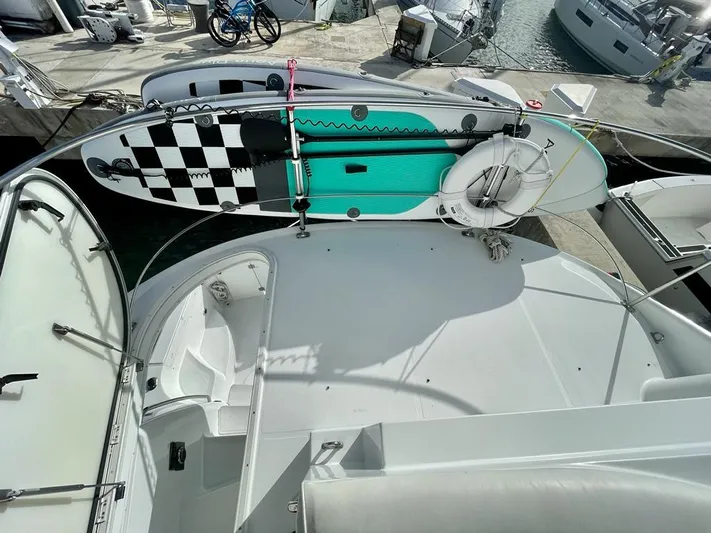  Yacht Photos Pics 2000 Carver 45 Voyager yacht deck with paddleboard and life preserver.