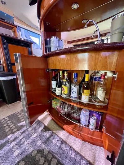  Yacht Photos Pics Bar area inside a 2000 Carver 45 Voyager yacht with stocked liquor cabinet.