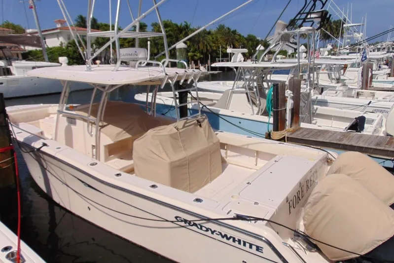 Fore Reel Yacht Photos Pics 2008 Grady-White Canyon 336 boat docked at marina, covered seats, sunny day.