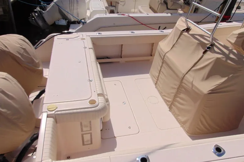 Fore Reel Yacht Photos Pics 2008 Grady-White Canyon 336 boat deck with covered seating and storage.