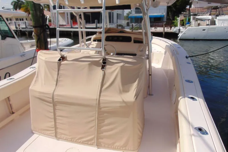 Fore Reel Yacht Photos Pics 2008 Grady-White Canyon 336 boat docked, featuring covered console and spacious deck.