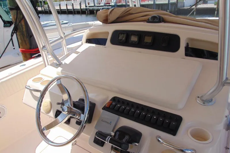 Fore Reel Yacht Photos Pics 2008 Grady-White Canyon 336 boat dashboard with steering wheel and controls.