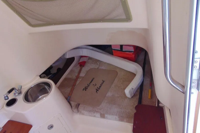 Fore Reel Yacht Photos Pics Interior of 2008 Grady-White Canyon 336 boat with sink and welcome mat.