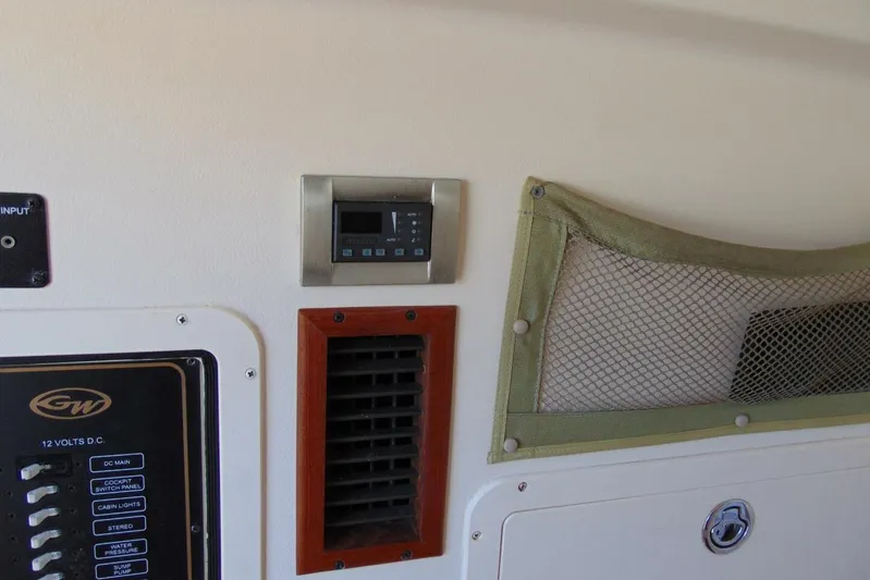 Fore Reel Yacht Photos Pics 2008 Grady-White Canyon 336 interior panel with control switches and storage net.