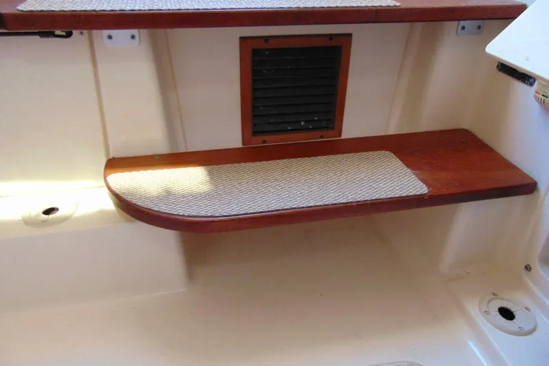 Fore Reel Yacht Photos Pics Interior step detail of 2008 Grady-White Canyon 336 boat with wooden finish.