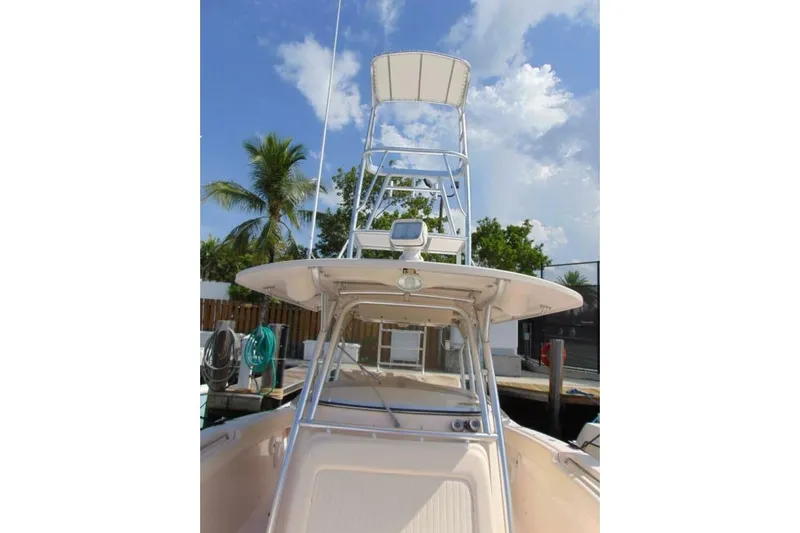 Fore Reel Yacht Photos Pics 2008 Grady-White Canyon 336 boat with tower, docked under a clear blue sky.