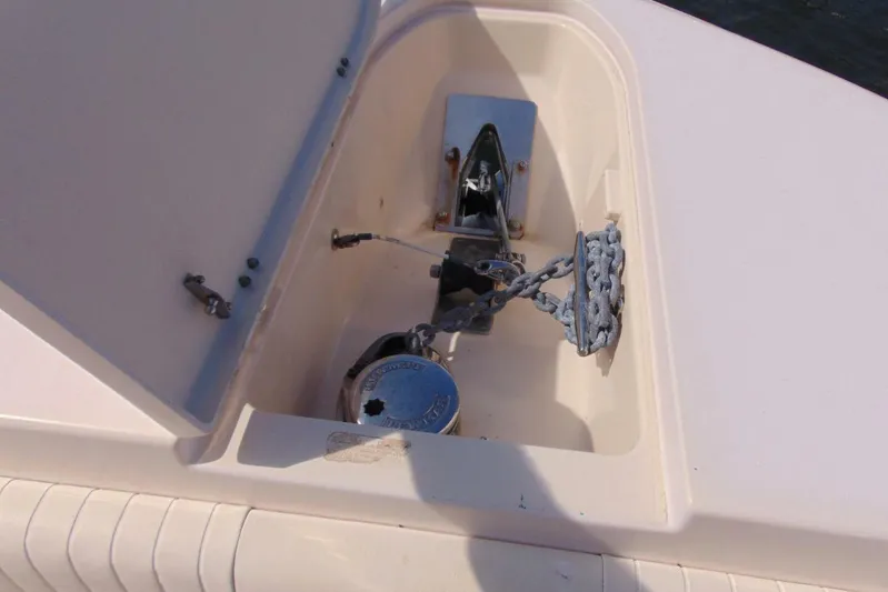 Fore Reel Yacht Photos Pics Anchor compartment of 2008 Grady-White Canyon 336 boat, featuring chain and winch.