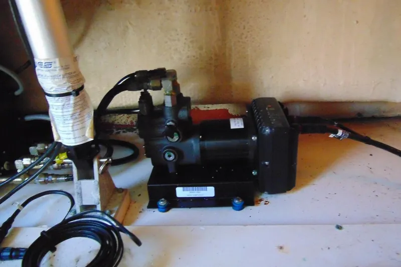 Fore Reel Yacht Photos Pics Hydraulic system inside 2008 Grady-White Canyon 336 boat, featuring cables and components.