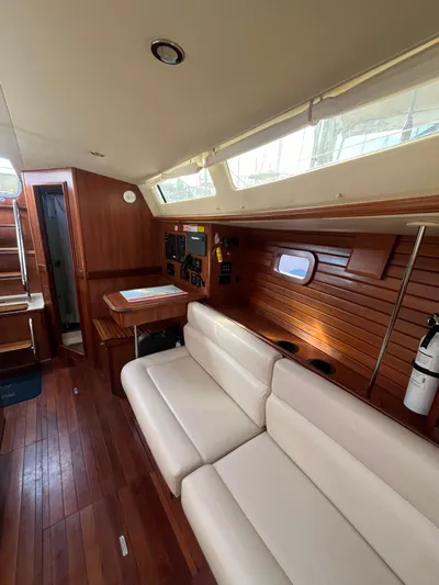 Pegasus Yacht Photos Pics Interior of 2015 Marlow-Hunter 40 yacht with wooden paneling and white seating.