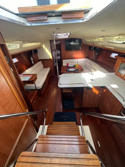 Pegasus Yacht Photos Pics Interior of 2015 Marlow-Hunter 40 yacht with wood finish and cozy seating area.