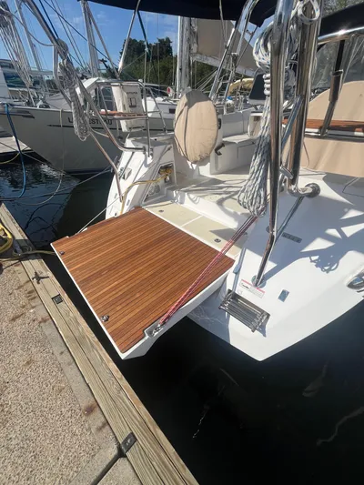 Pegasus Yacht Photos Pics 2015 Marlow-Hunter 40 sailboat with teak swim platform docked at marina.