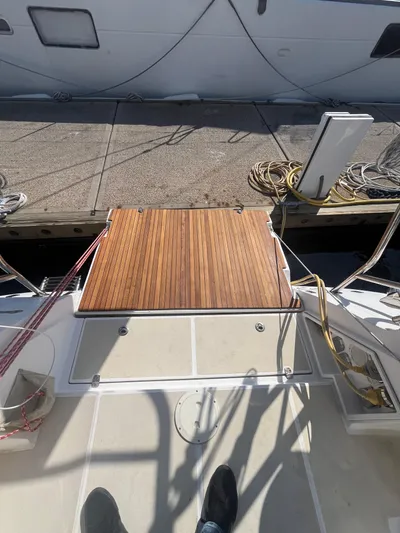 Pegasus Yacht Photos Pics Sailboat deck with wooden platform, Marlow-Hunter 40, 2015 model, docked at marina.