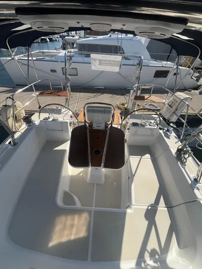 Pegasus Yacht Photos Pics 2015 Marlow-Hunter 40 sailboat cockpit with steering wheel, docked at marina.