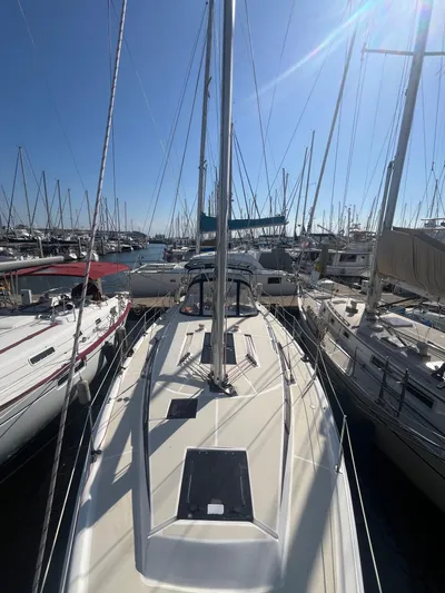 Pegasus Yacht Photos Pics 2015 Marlow-Hunter 40 sailboat docked among other boats in a sunny marina.