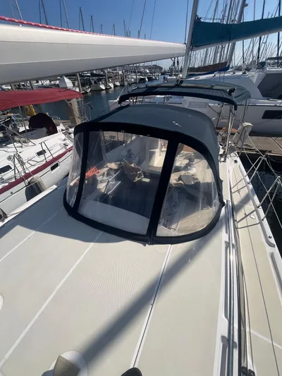 Pegasus Yacht Photos Pics 2015 Marlow-Hunter 40 sailboat docked at marina, featuring cockpit enclosure.