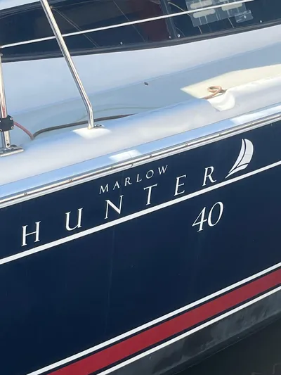 Pegasus Yacht Photos Pics 2015 Marlow-Hunter 40 sailboat with sleek navy and red design.